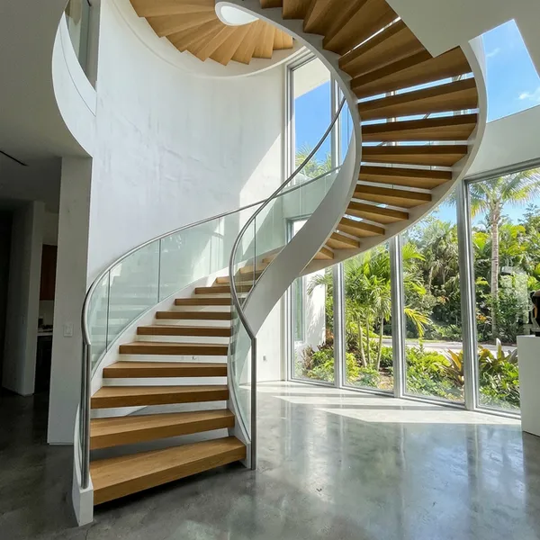 Curved cantilevered staircase feature detail in Toronto