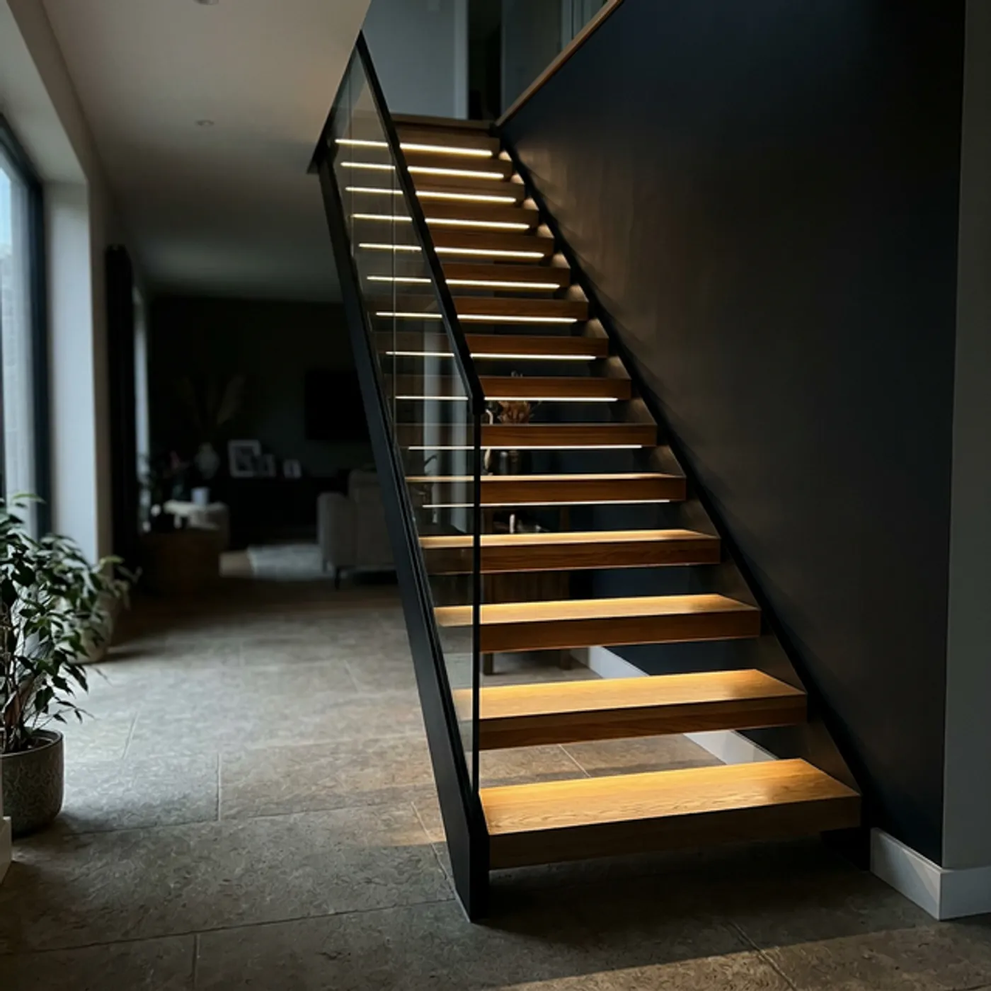 Integrated LED lighting on floating stairs in a Toronto home